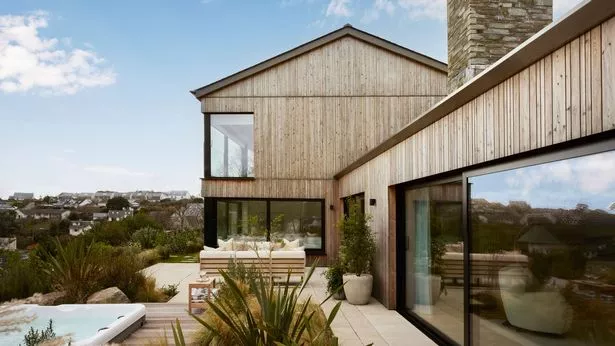 73-year-old Rose Doyle in front of her newly won $3 million home